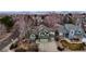 Aerial view showing a green two-story home with well-maintained landscaping and a multi-car garage at 360 Peregrine Cir, Broomfield, CO 80020