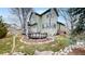 Charming two-story home boasts a landscaped backyard and an inviting round deck at 360 Peregrine Cir, Broomfield, CO 80020