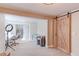 A bright, flexible basement space includes a sliding barn door, and ample workspace at 360 Peregrine Cir, Broomfield, CO 80020