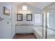 This bathroom features a double vanity, soaking tub, private toilet, and wood look tile floors at 360 Peregrine Cir, Broomfield, CO 80020