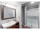 Modern bathroom with walk-in shower, vanity, and neutral color palette for a clean and refreshed look at 360 Peregrine Cir, Broomfield, CO 80020