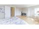 This bedroom features wood floors and lots of natural light from the large window and skylights at 360 Peregrine Cir, Broomfield, CO 80020