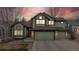 Charming home exterior with a well-manicured lawn, multi-car garage and inviting front entrance at 360 Peregrine Cir, Broomfield, CO 80020