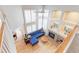 Bright living room with large windows, fireplace, and hardwood floors at 360 Peregrine Cir, Broomfield, CO 80020