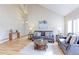 Cozy living room featuring hardwood floors, comfortable seating, and natural light at 360 Peregrine Cir, Broomfield, CO 80020