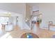 Spacious interior view showcasing hardwood floors, staircase, and open living space at 360 Peregrine Cir, Broomfield, CO 80020