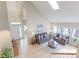 Bright living room with high ceilings, skylights, and an open, airy layout at 360 Peregrine Cir, Broomfield, CO 80020