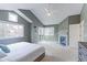 This main bedroom has vaulted ceilings, a gas fireplace, lots of light, and doors to a private balcony at 360 Peregrine Cir, Broomfield, CO 80020