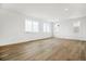 Light-filled living space features hardwood flooring and views of the outdoors at 8213 Butte Creek St, Littleton, CO 80125