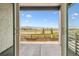 A serene view from an open patio overlooking the landscape at 8213 Butte Creek St, Littleton, CO 80125