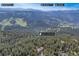 Aerial view showcasing the property's proximity to Mount Blue Sky and the Continental Divide at 900 Ballantine Rd, Golden, CO 80401