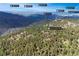 Aerial view of home's location relative to White Ranch Park and the surrounding mountains and attractions at 900 Ballantine Rd, Golden, CO 80401