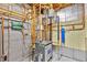 View of the home's water heater, water filter, and plumbing setup at 900 Ballantine Rd, Golden, CO 80401