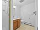 Bathroom featuring a tiled shower, tile floor, and wood vanity at 900 Ballantine Rd, Golden, CO 80401