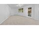 Bonus room with carpet, natural light, and a door to the outside at 900 Ballantine Rd, Golden, CO 80401