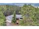 Secluded home exterior nestled in the woods with mountain views at 900 Ballantine Rd, Golden, CO 80401