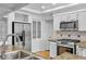 Updated kitchen with stainless steel appliances and granite counters at 900 Ballantine Rd, Golden, CO 80401