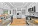 Bright kitchen with stainless appliances, granite counters, and hardwood floor at 900 Ballantine Rd, Golden, CO 80401
