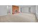 Spacious living room with a brick fireplace and neutral carpet, bright and airy at 900 Ballantine Rd, Golden, CO 80401