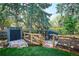 Backyard featuring a chicken coop and shed surrounded by a wood fence and mature trees at 3666 S Jersey St, Denver, CO 80237