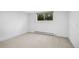 Finished basement with neutral carpet, natural light from window at 3666 S Jersey St, Denver, CO 80237