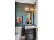 Stylish powder room features a unique wallpaper and contemporary vanity at 3666 S Jersey St, Denver, CO 80237