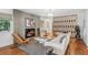 Modern living room with stylish fireplace, comfortable seating, and wood floors at 3666 S Jersey St, Denver, CO 80237