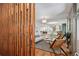 Bright, open-concept living room features hardwood floors, modern decor, and decorative wood paneling at 3666 S Jersey St, Denver, CO 80237