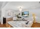 Elegant living room featuring hardwood floors, a stylish sofa, and large windows offering abundant natural light at 3666 S Jersey St, Denver, CO 80237