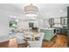 Open concept living space combining the kitchen, dining, and living areas for seamless entertaining at 3666 S Jersey St, Denver, CO 80237