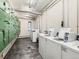 Community laundry room equipped with multiple washers and dryers for resident convenience at 1050 N Corona St # 105, Denver, CO 80218