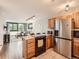 Open-concept space featuring a fully equipped kitchen flowing into a cozy living area with large windows at 1050 N Corona St # 105, Denver, CO 80218
