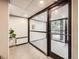 Apartment lobby with secure entry and glass doors, offering a view of the outside at 1050 N Corona St # 105, Denver, CO 80218
