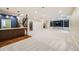Finished basement with a bar area, custom built-ins, and a spacious entertainment zone at 2362 Spruce Way, Denver, CO 80238