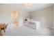 Cozy bedroom with a built-in bookcase headboard and an adjoining room visible through the archway at 2362 Spruce Way, Denver, CO 80238