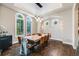 Dining room featuring hardwood floors, modern chandelier, and large arched windows at 2362 Spruce Way, Denver, CO 80238