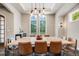 Bright dining room featuring hardwood floors and large windows with seating for eight at 2362 Spruce Way, Denver, CO 80238