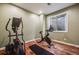 Bright exercise room with an elliptical and a stationary bike, perfect for home workouts at 2362 Spruce Way, Denver, CO 80238
