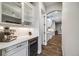 Beautiful kitchen with white cabinetry, a wine fridge, and sleek countertops at 2362 Spruce Way, Denver, CO 80238