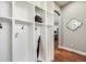 Mudroom showcases built-in cubbies and hooks for storage at 2362 Spruce Way, Denver, CO 80238