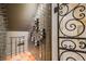 Wine cellar with wrought iron gate and metal storage racks for bottles, creating a stylish space at 2362 Spruce Way, Denver, CO 80238