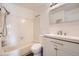 The bathroom features tile, a vanity with storage, and a shower/tub combination at 63 S Sable Blvd # E22, Aurora, CO 80012