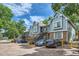 Blue townhouses with brick bases, private entrances, and parking spaces in a leafy neighborhood at 63 S Sable Blvd # E22, Aurora, CO 80012