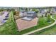 Aerial view of the home with a gravel backyard surrounded by a wood fence and large deck at 9721 Marmot Ridge Cir, Littleton, CO 80125