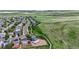 This is an aerial view of a home that is next to a large grass field with walking trails, and has great views at 9721 Marmot Ridge Cir, Littleton, CO 80125