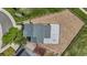 This is an aerial view of a house that is surrounded by a wooden fence, plus a large gravel area on the north side at 9721 Marmot Ridge Cir, Littleton, CO 80125