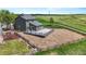 The oversized backyard with a wood fence, gravel, and deck overlooking pastureland at 9721 Marmot Ridge Cir, Littleton, CO 80125