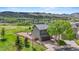Charming exterior showcasing a well-maintained lawn and views of the mountains in the distance at 9721 Marmot Ridge Cir, Littleton, CO 80125