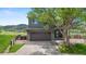 Charming two-story home with a spacious two-car garage, fenced yard, and beautiful landscaping at 9721 Marmot Ridge Cir, Littleton, CO 80125