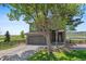 Charming two-story home with a spacious two-car garage, fenced yard, and beautiful landscaping at 9721 Marmot Ridge Cir, Littleton, CO 80125